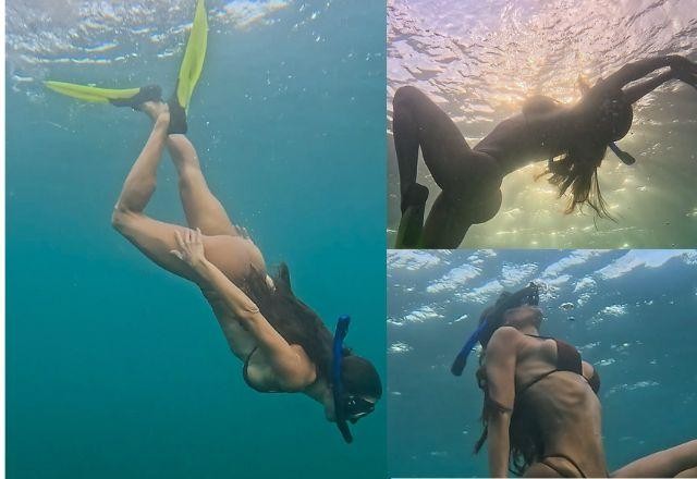 Deborah Secco exibe corpo ao mergulhar de biquini